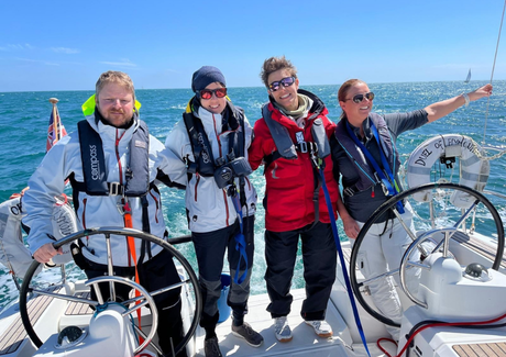Participants smiling while steering the Duel on a yachting taster